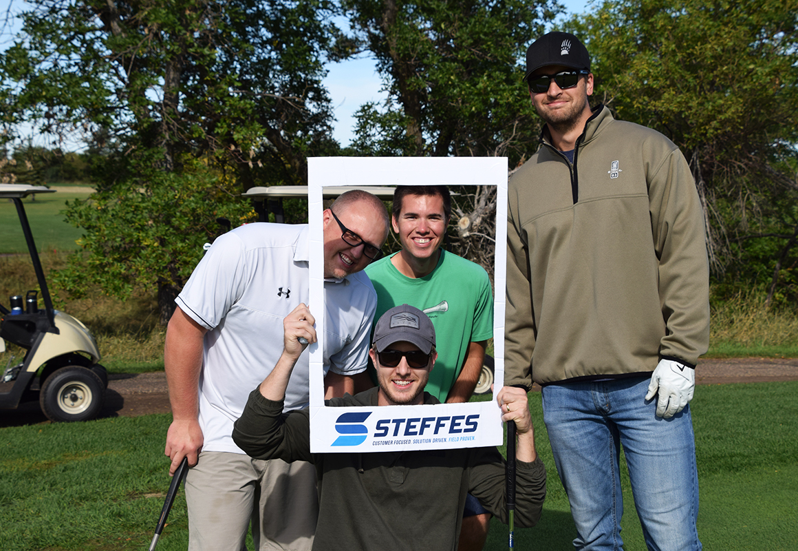 a group of Steffes engineers at our annual Golf Scramble, including Austin Krank